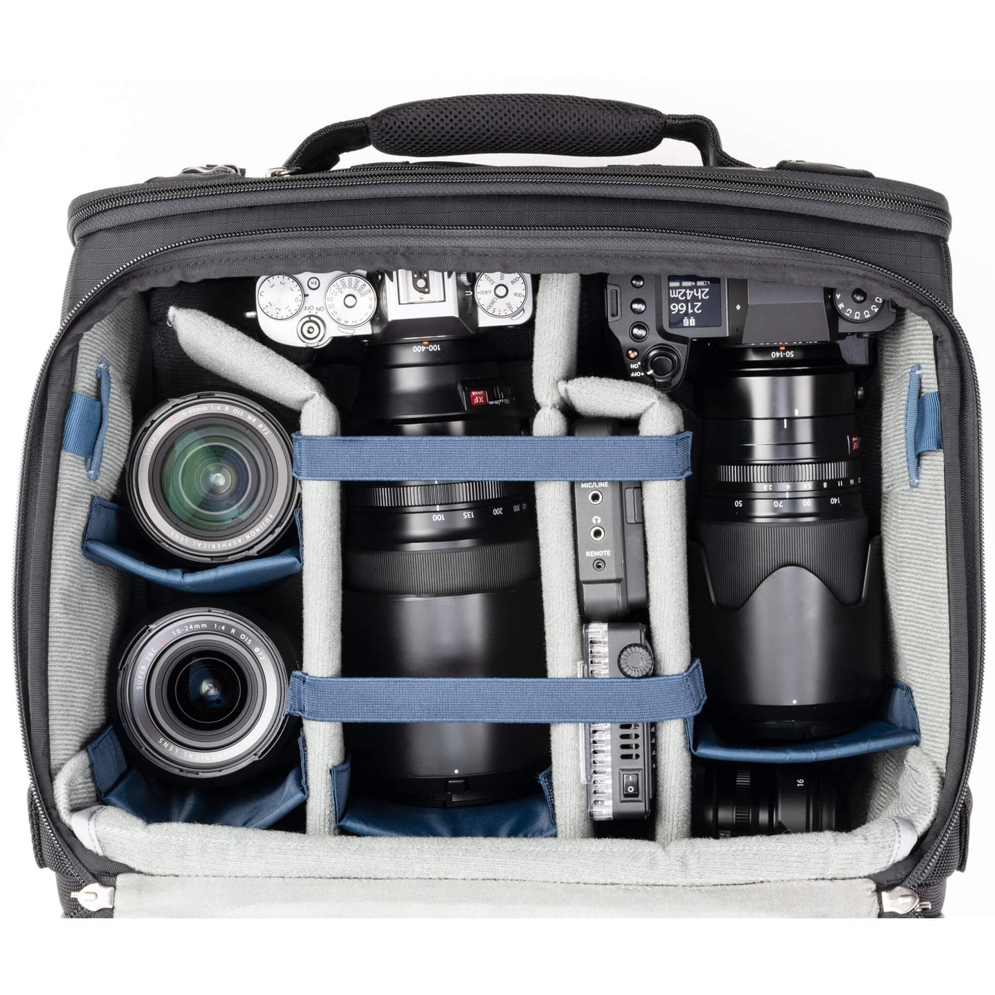 
                  
                    FujiFilm XT-1 with 100-400mm f/4.5-5.6 mounted, X-H2S with 50-140mm f/2.8 mounted, 16mm f/2.8, 16-80mm f/4, 10-24mm f/4, field monitor, and a LED light panel
                  
                